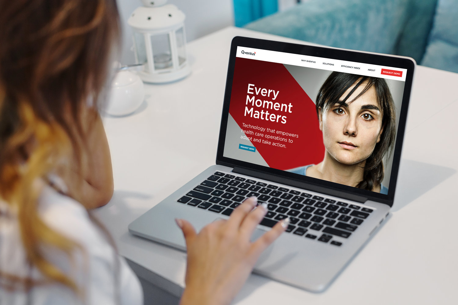 Qventus homepage shown on a laptop